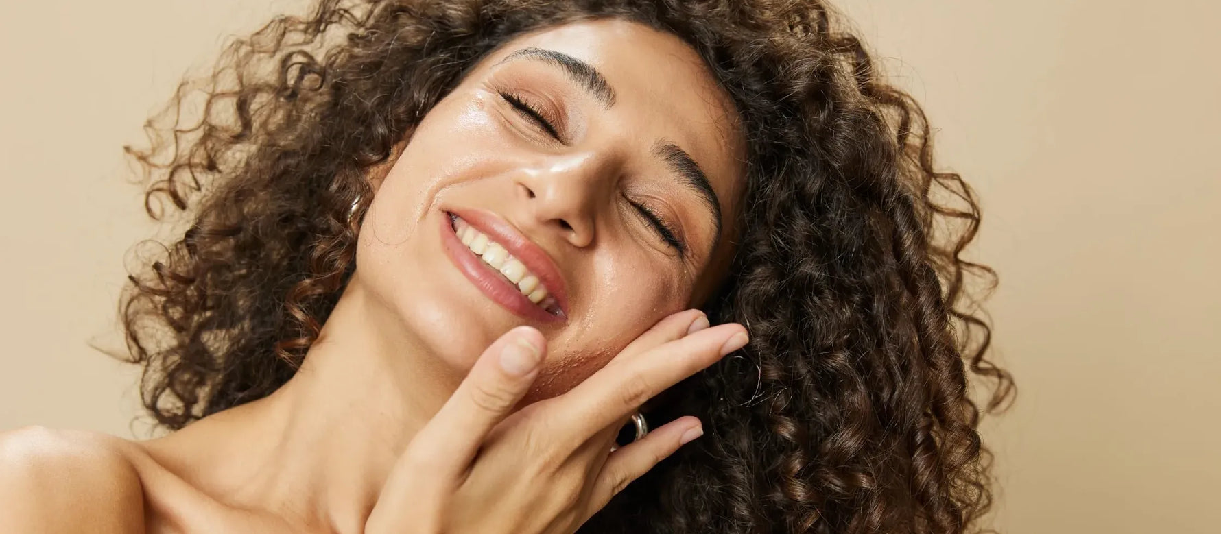 A person applying cleanser and moisturizer, showcasing an effective skincare routine for healthy skin.