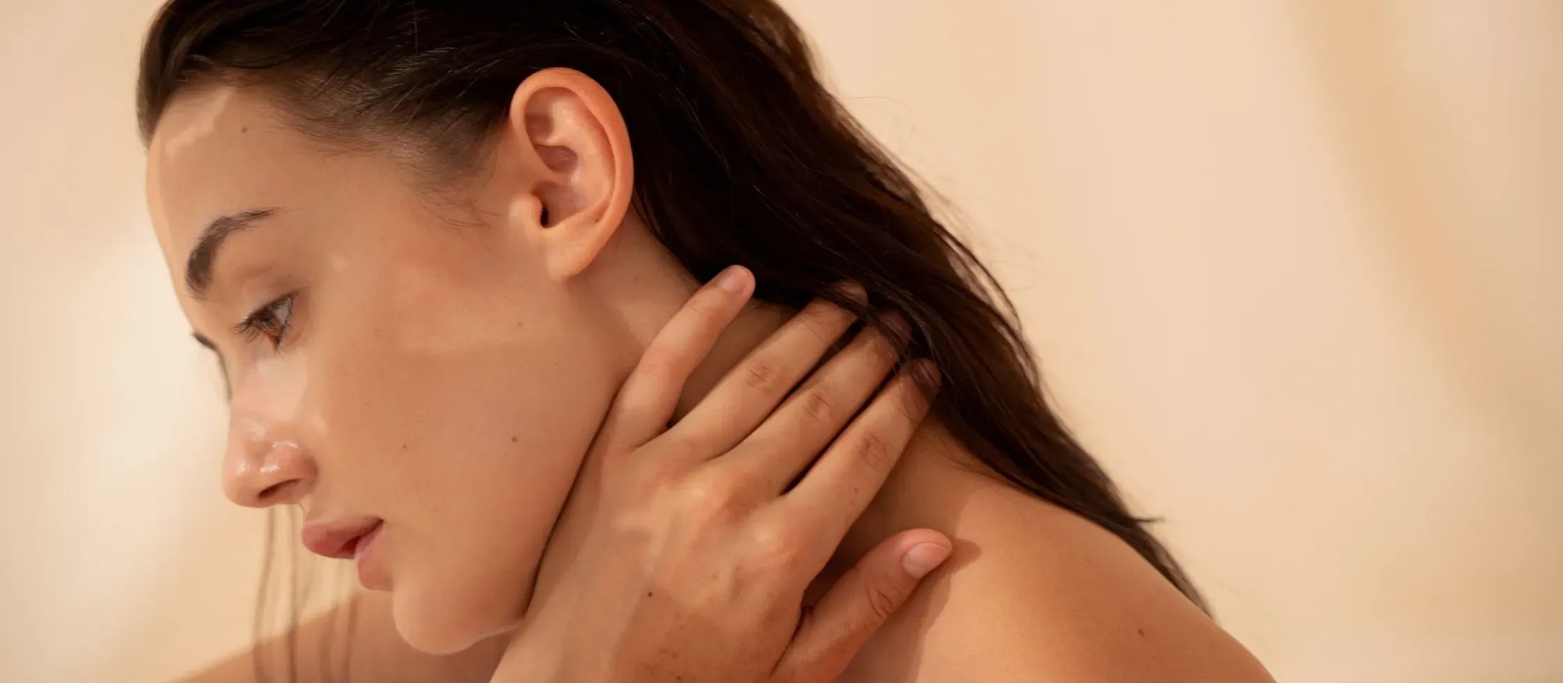 A woman applying the #1 recommended face moisturizer for glowing skin and hydration.
