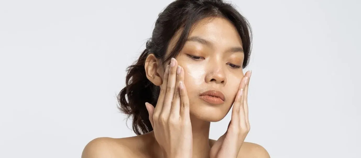 A close-up of salicylic acid skincare products on a marble surface, promoting clear skin benefits.