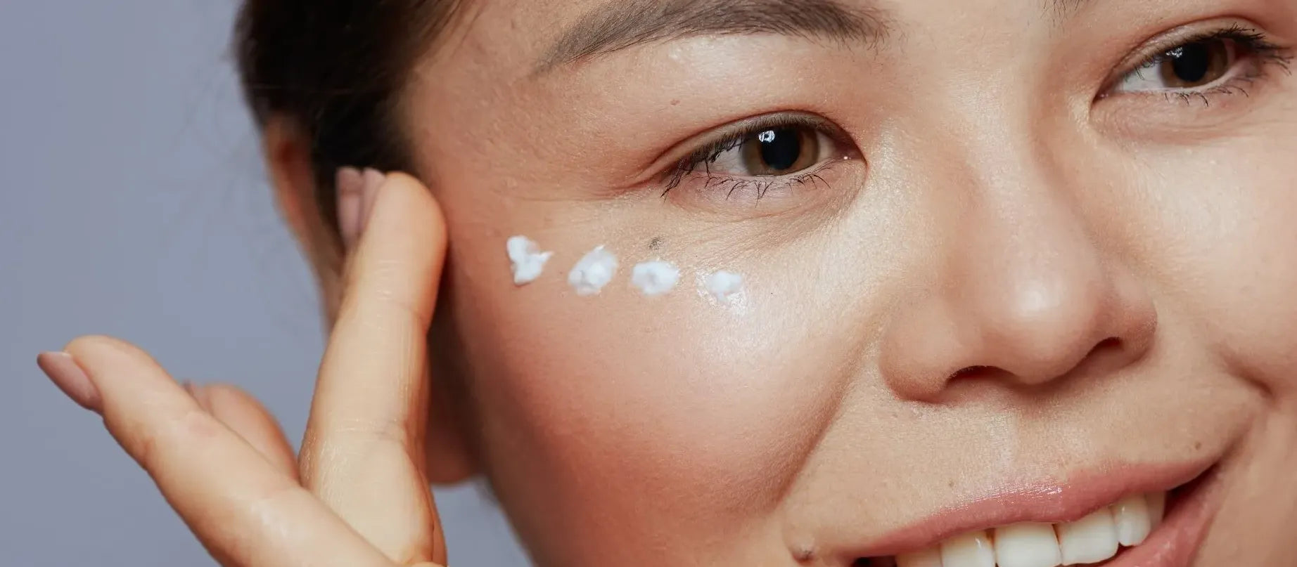 A person applying salicylic acid on their skin, highlighting its safety and benefits for acne treatment.