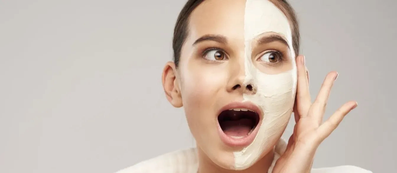 A woman applying oil cleanser to her face, exploring the benefits of oil cleansing for healthy skin.