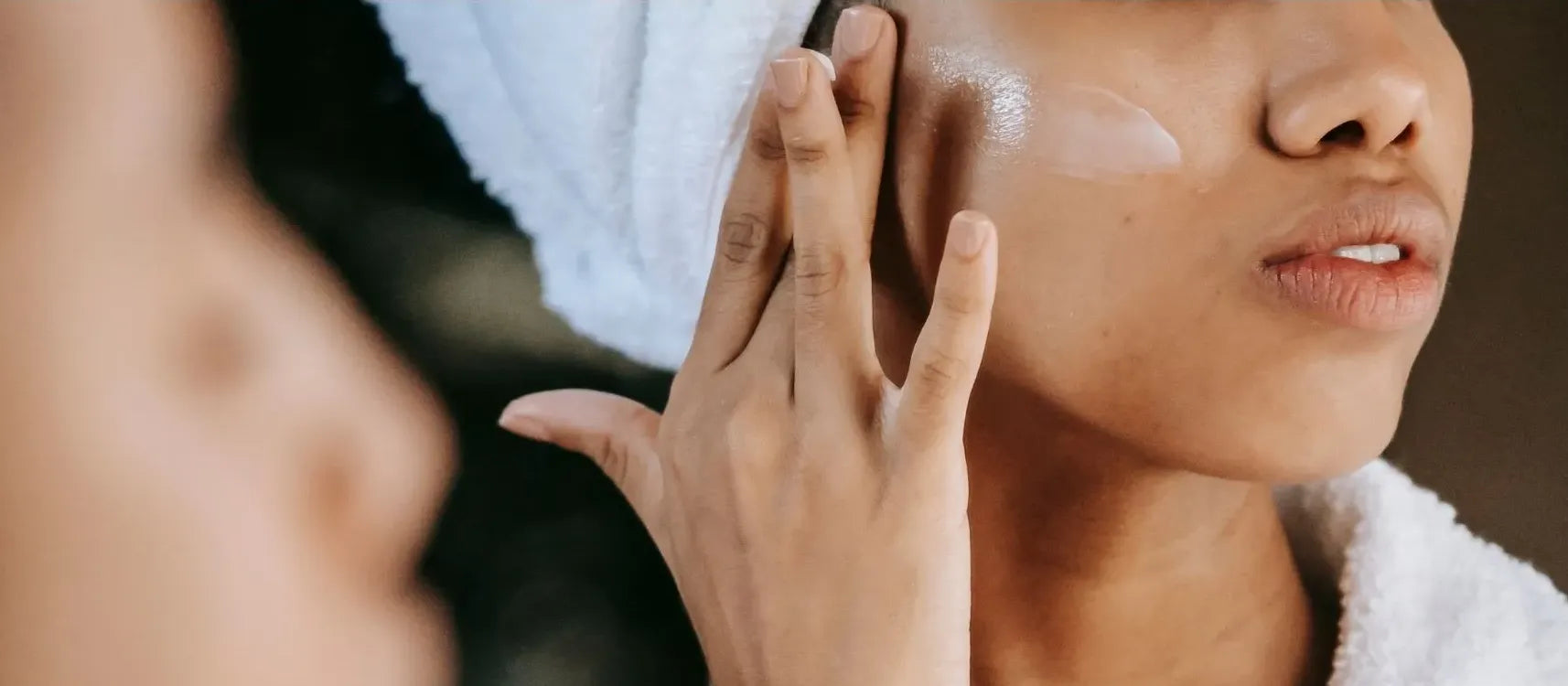 A person demonstrating effective face washing techniques to clear acne and improve skin health.