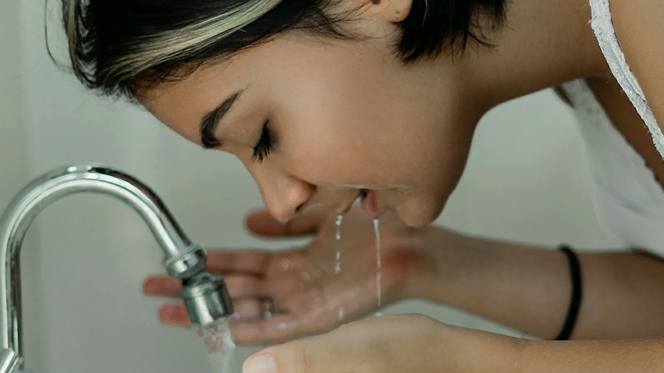 A soothing mild cleanser bottle for acne-prone skin on a bathroom counter, promoting gentle skincare solutions.