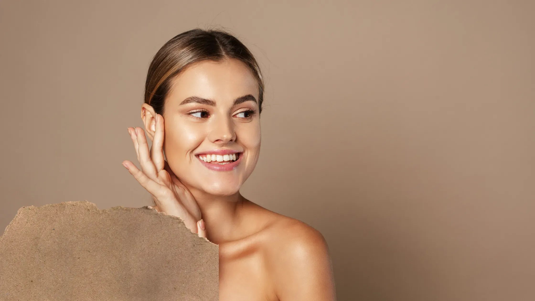 A selection of oily acne-prone skin cleansers displayed on a bathroom counter.